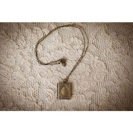 On the Seventh Day of Christmas, Leonard Gives... Book Locket Necklace: A Story Waiting to Be Told - Myth & Ink: Worlds of C.A. Smith